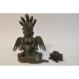 A modern Chinese bronze of a God like figure and a