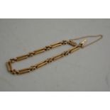 A 15ct gold gate bracelet 9g approx