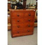 A mahogany chest of drawers fitted with two short