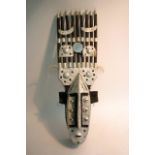 An African Bamana tribal mask with aluminium decor