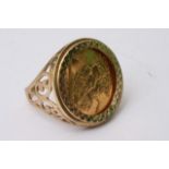 A 9ct gold ring inset with a half sovereign. 7g to