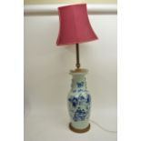 An Oriental blue and white vase converted in to ta