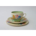 A Clarice Cliff crocus pattern trio, gold Royal St