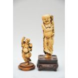 Two 19th Century carved Ivory Buda figures on base