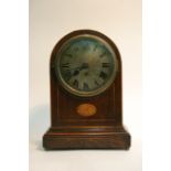 An edwardian inlaid mantel clock