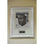 A framed and glazed signed black and white photo o