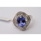 A 14ct white gold, diamond and tanzanite ring, dia