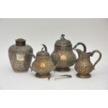 A four piece Chinese silver teaset comprising tea