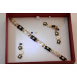 A Chinese 9ct gold and Mother of Pearl bracelet wi