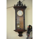 A mahogany cased 8 day wall clock with white ename