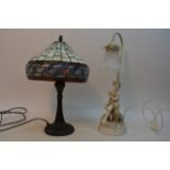 A Tiffany style table lamp and a figural lamp depi