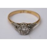 An 18ct gold diamond ring (Size M)