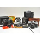 Two Zenith cameras, Kodak, small Olympus trip, Voi