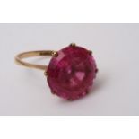 A 9ct gold ring inset with pink stone