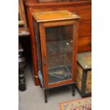 A small square Edwardian cabinet