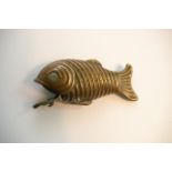A Victorian brass vesta case in the form of a fish