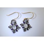 A pair of moonstone, diamond and amethyst drop earrings.