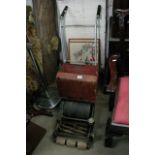 A vintage push lawnmower.
