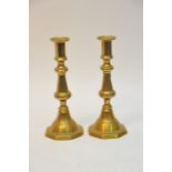 A pair of brass candlesticks