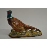 A Beswick model of a pheasant,,impressed number 12