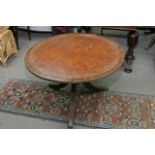 A leather topped tilt top circular table, diameter