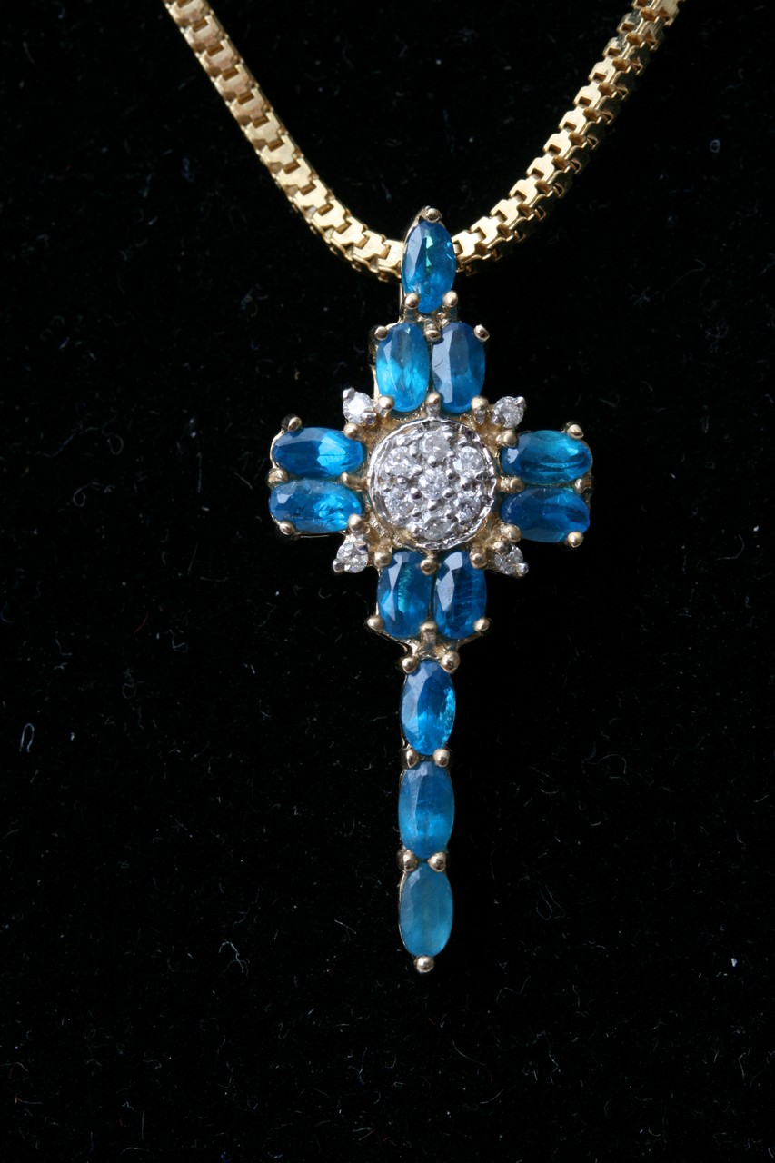 A 925 silver gilt necklace and cross set with blue