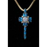 A 925 silver gilt necklace and cross set with blue