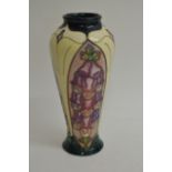 A boxed Moorcroft 'Foxglove' pattern vase of tape