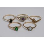 Five gold rings set with various coloured stones t