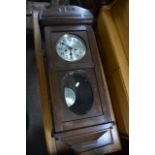 a 1930'S oak 8 day wall clock with silvered dial.