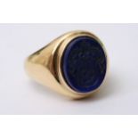 An 18ct gold seal ring set with a polished blue st
