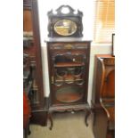 A Mahogany Edwardian music cabinet with mirror bac