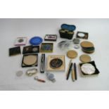 A box containing Compacts ,Ivory Opera glasses and