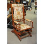 An upholstered American style rocking chair.