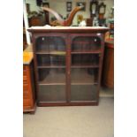 A Victorian walnut double door bookcase enclosing