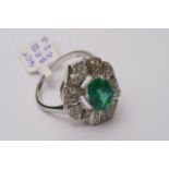 A 14ct white gold, fancy emerald and diamond ring,