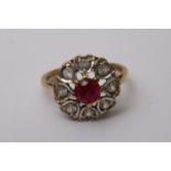 A 9ct gold ring inset Ruby and white stones