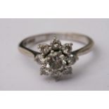 An 18ct white gold diamond cluster ring, approxima