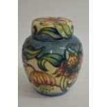 A boxed Moorcroft 'Anna Lily' pattern ginger jar.