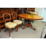 A Victorian Mahogany Oval dining table on shaped c