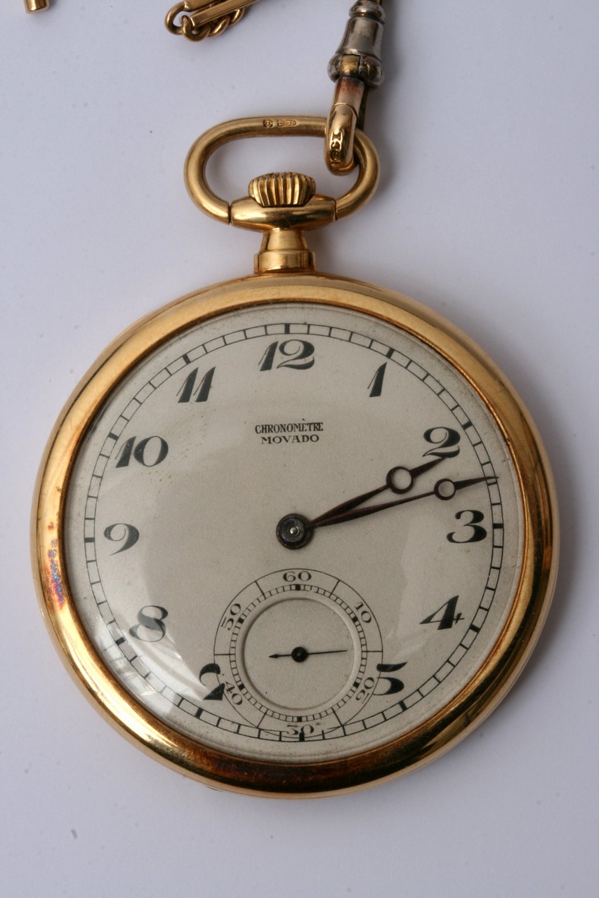 A Movado 18ct gold button wind pocket watch with a