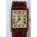 A boxed Gentleman's Cartier tank watch with hallma