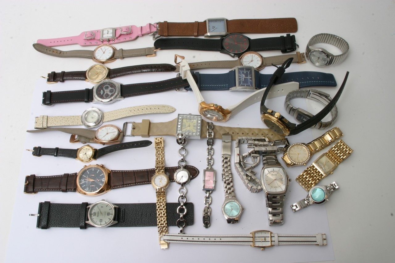 A bag containing various watches including Bench,