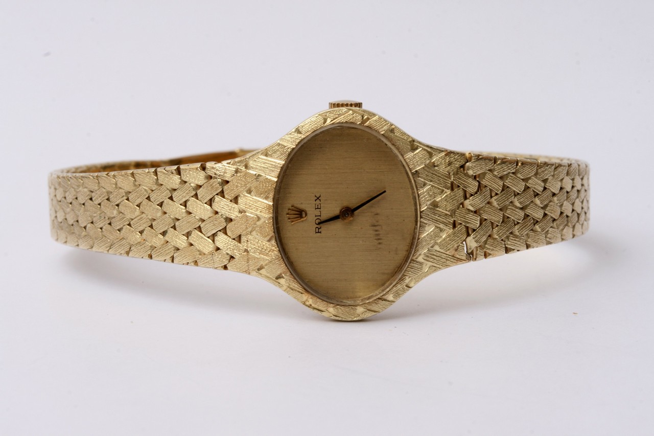 A lady's Rolex watch all 14ct gold with a woven st