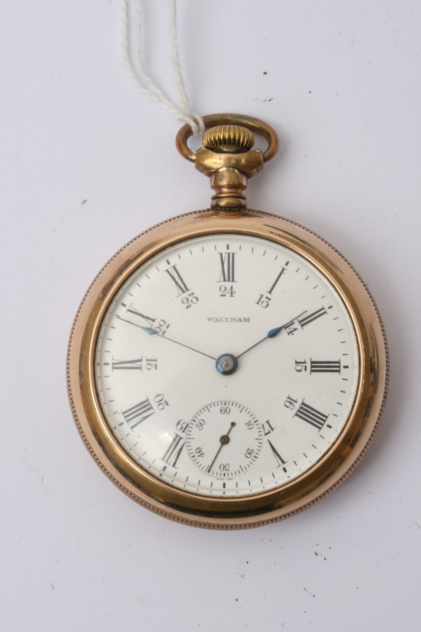 A gold plated Waltham pocket watch with screw fix