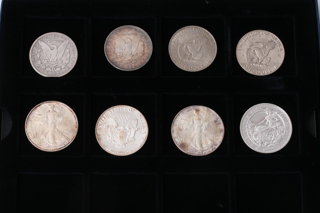 A collection of eight predominantly silver coins c