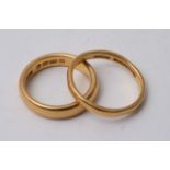 Two 22 carat gold wedding band rings.