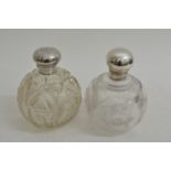 A silver and cut glass scent bottle the cap decora