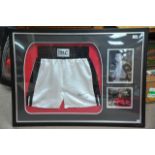 A signed and framed Mohammed Ali white shorts, two