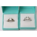 Two boxed QVC silver CZ rings, sizes M and T.